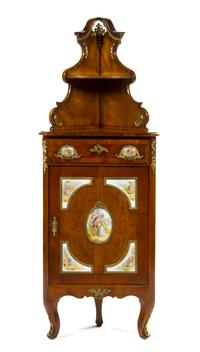 A German Burlwood and Porcelain Mounted Corner Cabinet, Height 64 x width 24 x depth 12 inches.