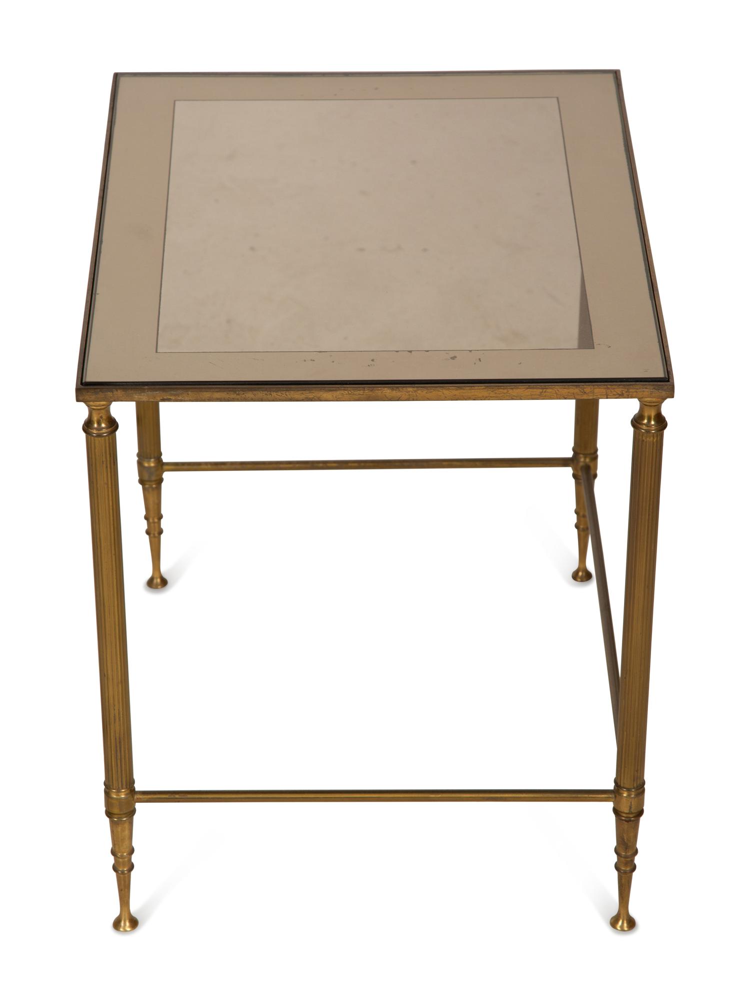 A Set of Three Gilt Metal Nesting Tables in the Style of Maison Jansen