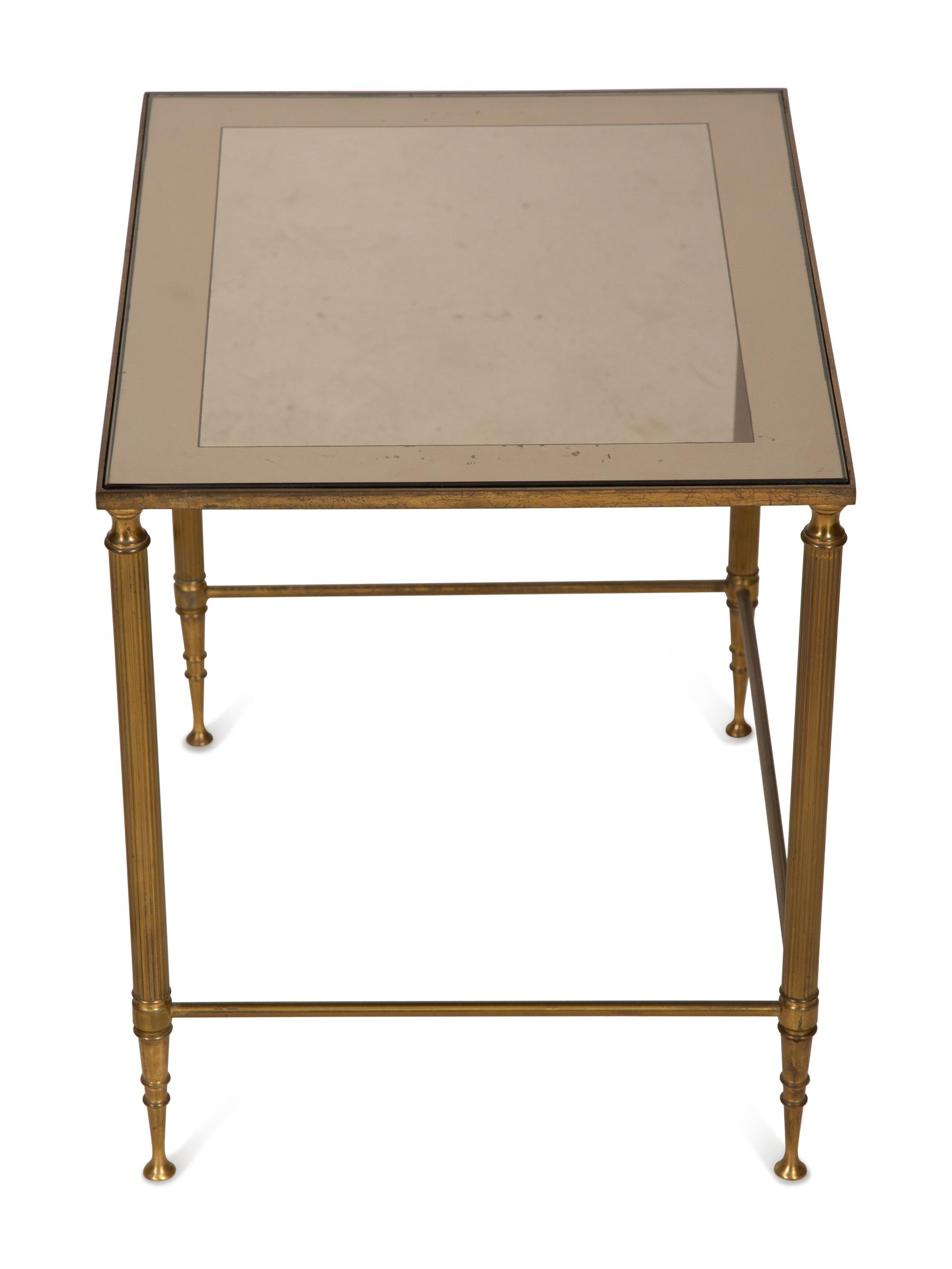 A Set of Three Gilt Metal Nesting Tables in the Style of Maison Jansen