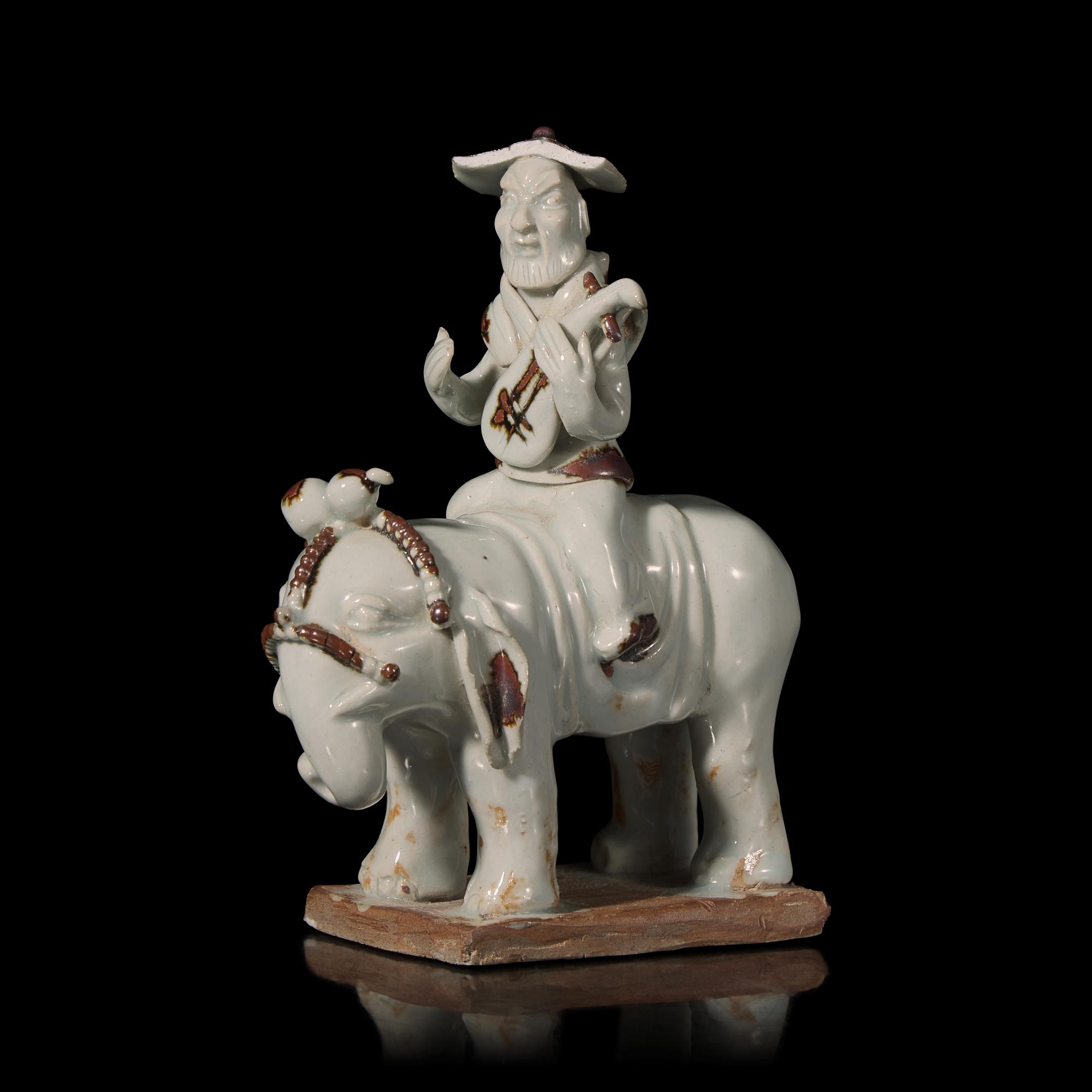 A Chinese Hutian Spotted Qingbai Glazed Porcelain Foreign Musicians Riding an Elephant — 湖田窯青白釉胡人琵琶騎象俑