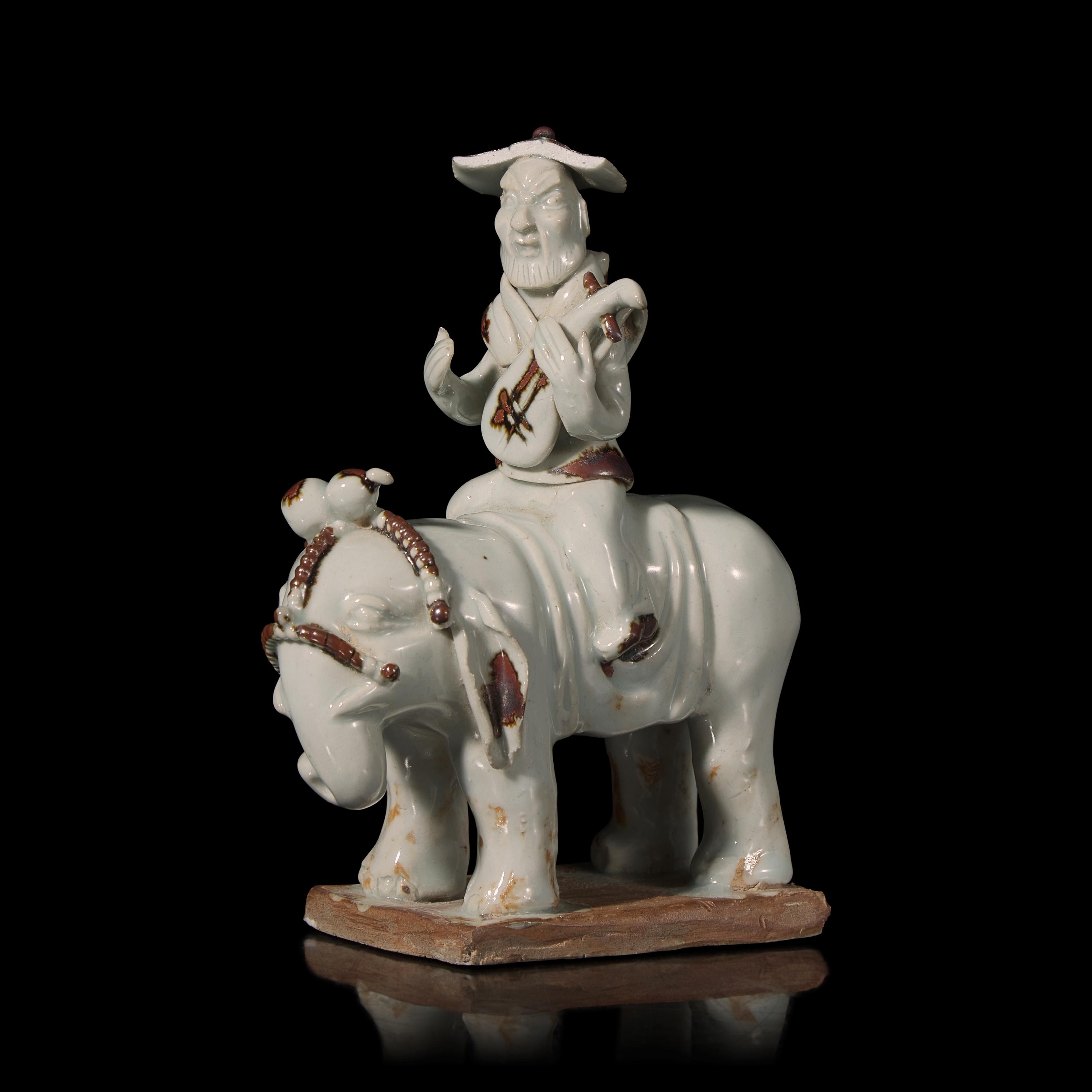 A Chinese Hutian Spotted Qingbai Glazed Porcelain Foreign Musicians Riding an Elephant — 湖田窯青白釉胡人琵琶騎象俑