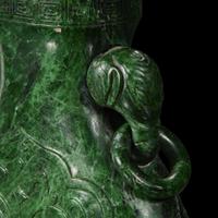 A Chinese carved chloromelanite vase and cover 玉盖罐