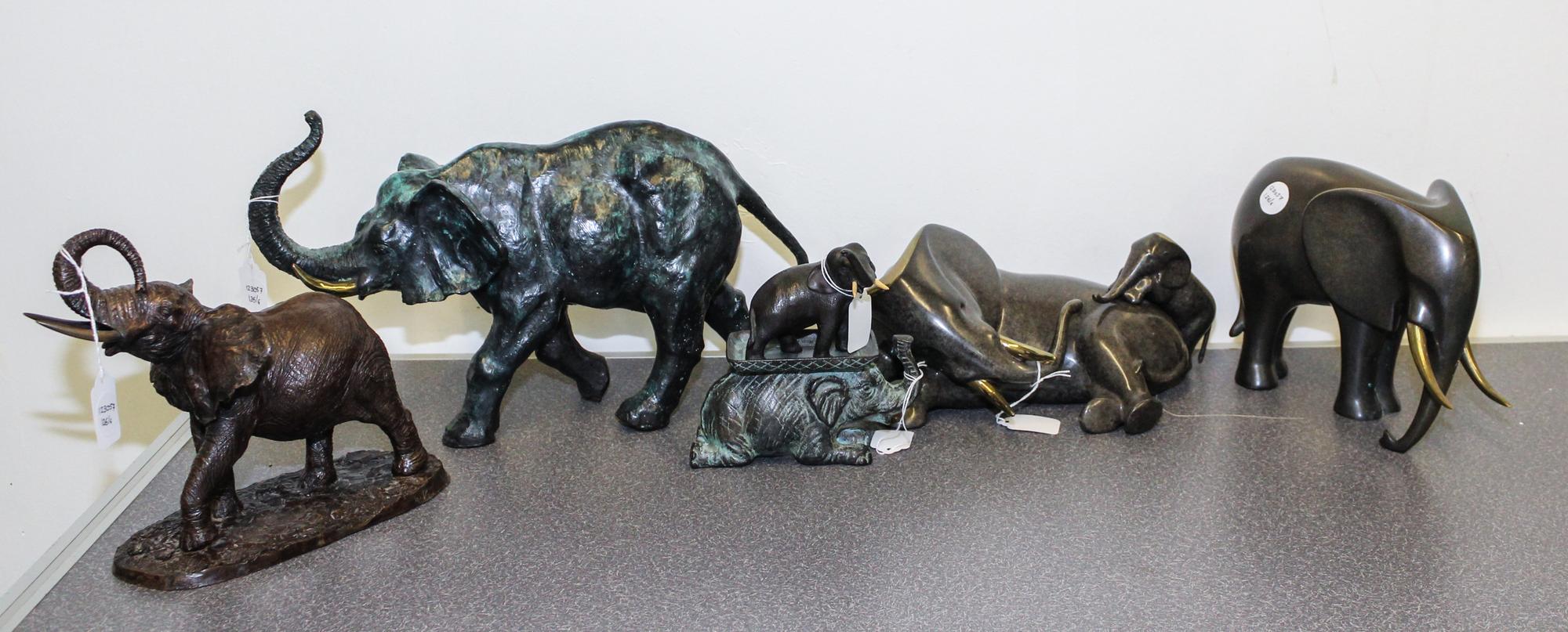 A Group of Five Metal Elephant Figures Height of tallest 9 1/2 inches.