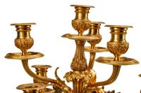 A Pair of Louis XV Style Gilt Bronze and Marble Seven-Light Candelabra