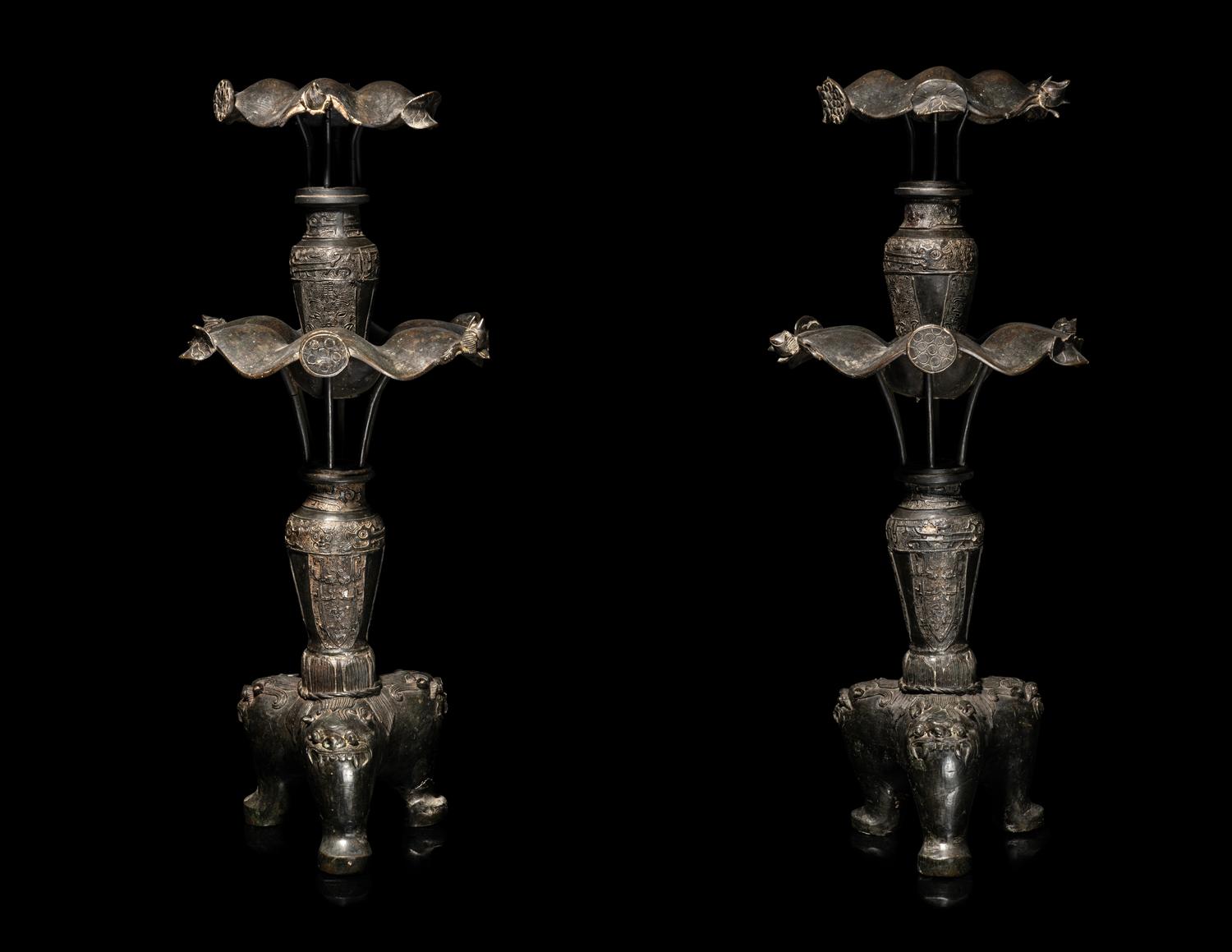 A Large Pair of Bronze Candle Holders