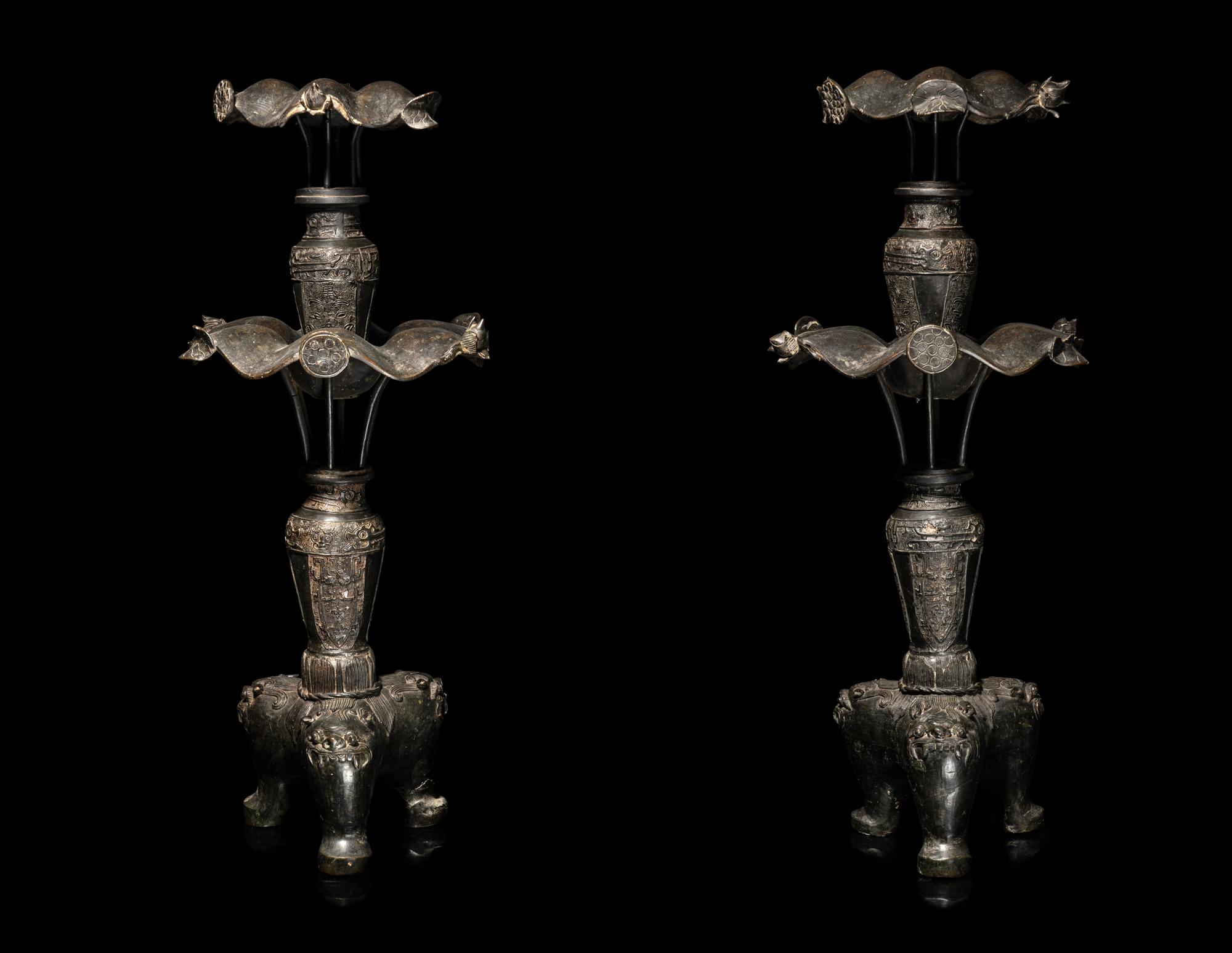 A Large Pair of Bronze Candle Holders