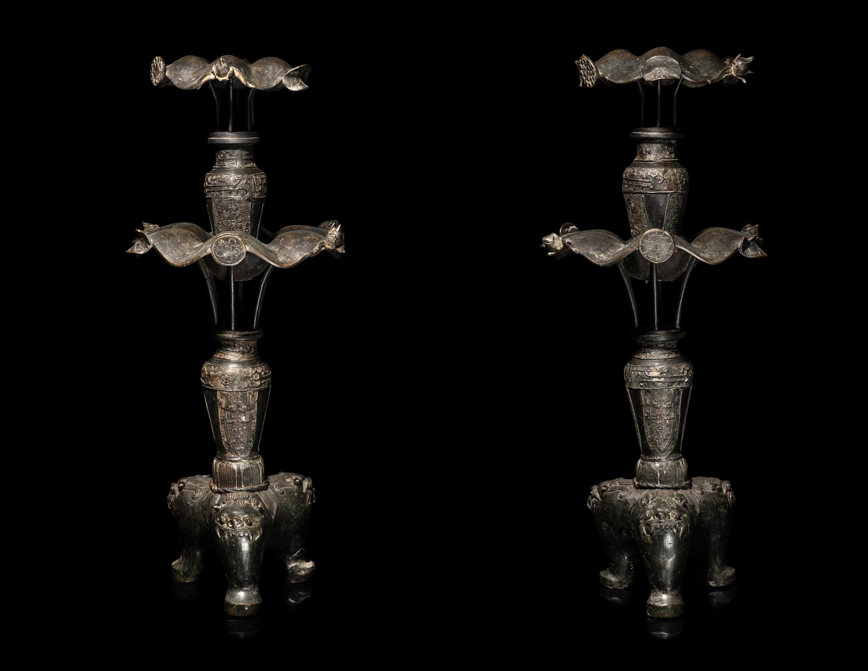 A Large Pair of Bronze Candle Holders