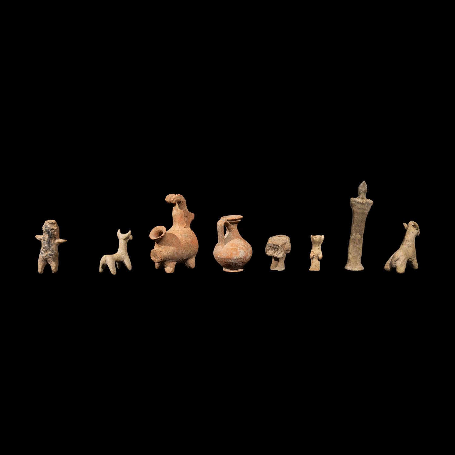 Eight Near Eastern Terracotta Figurines and Vessels