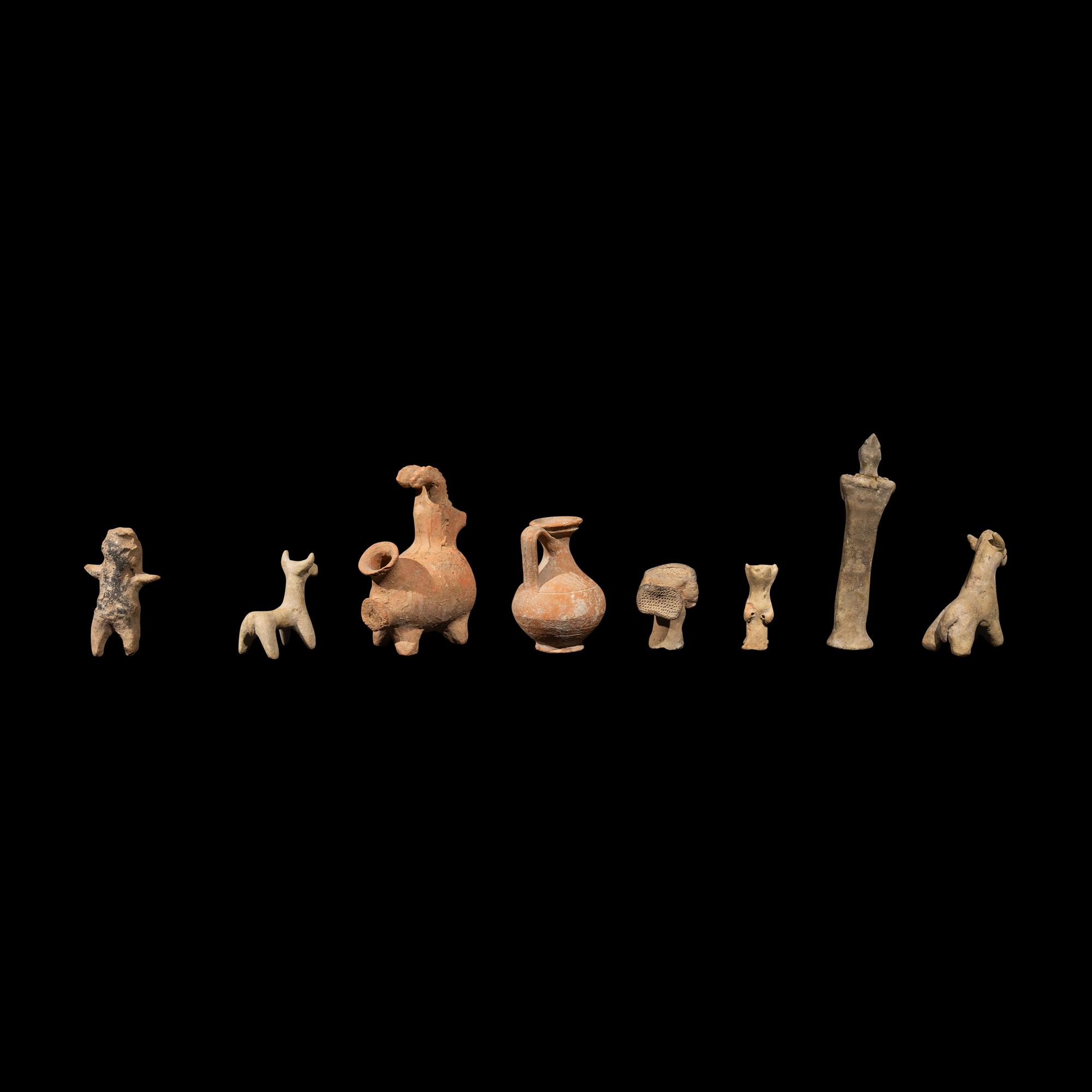 Eight Near Eastern Terracotta Figurines and Vessels