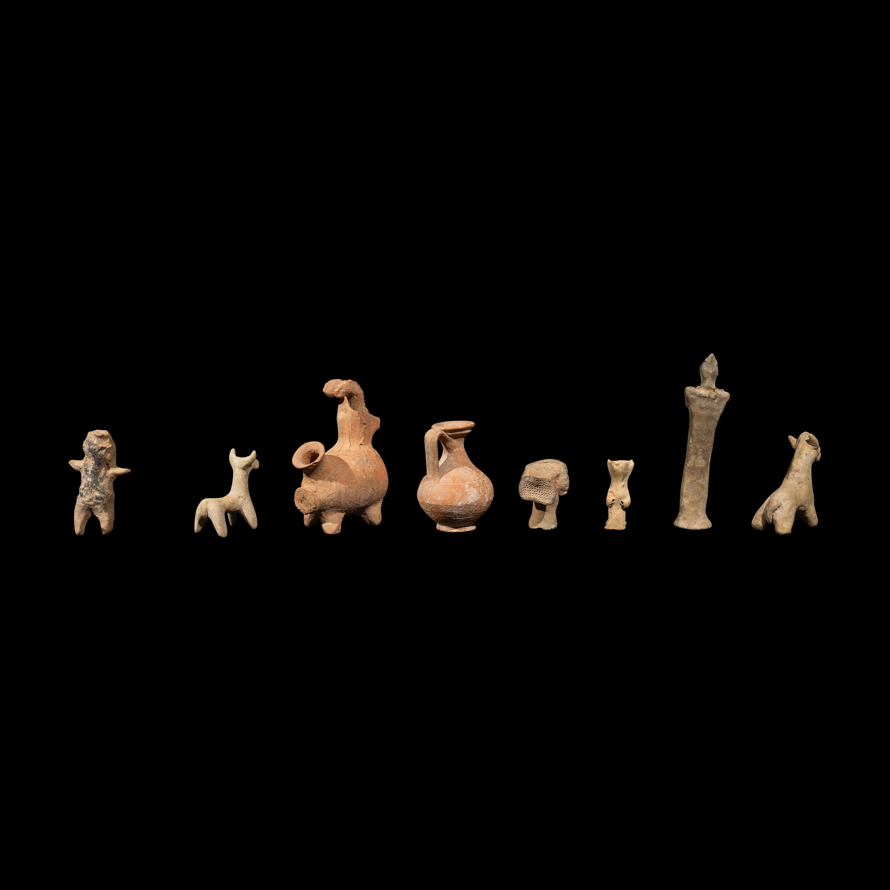 Eight Near Eastern Terracotta Figurines and Vessels