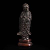 A Chinese carved dark soapstone Luohan 寿山石雕罗汉