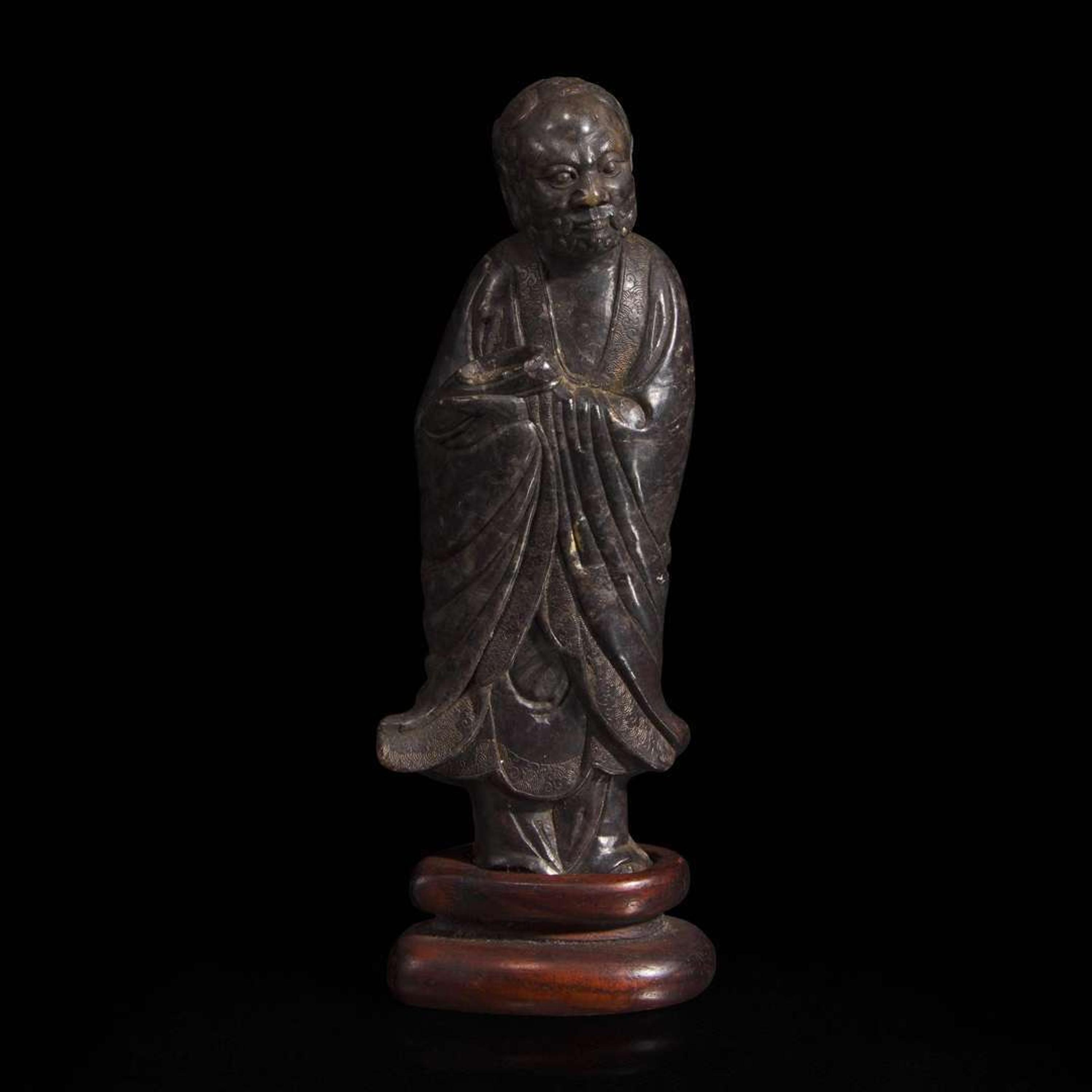 A Chinese carved dark soapstone Luohan 寿山石雕罗汉