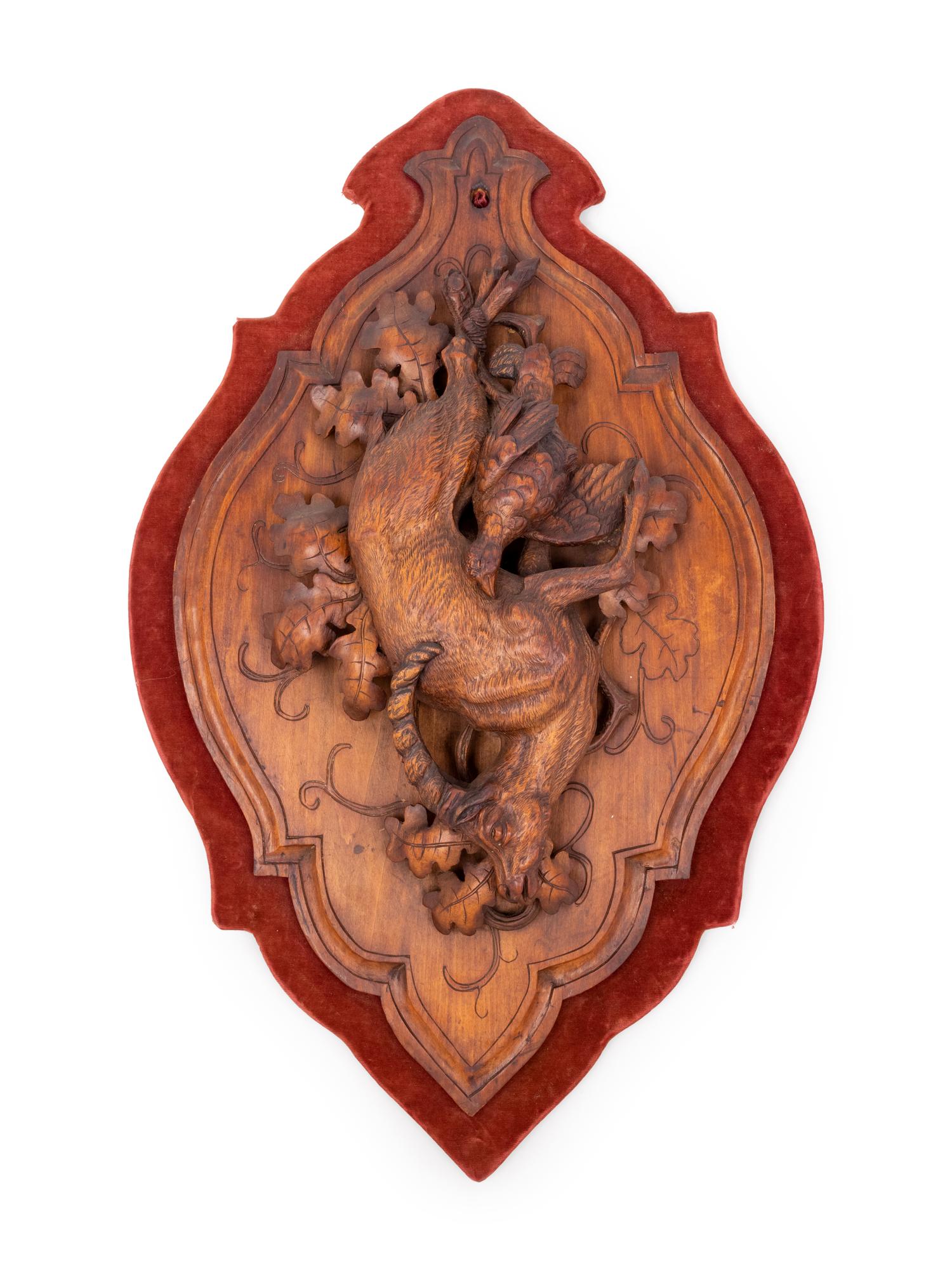 A Black Forest Carved Game Plaque