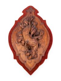A Black Forest Carved Game Plaque