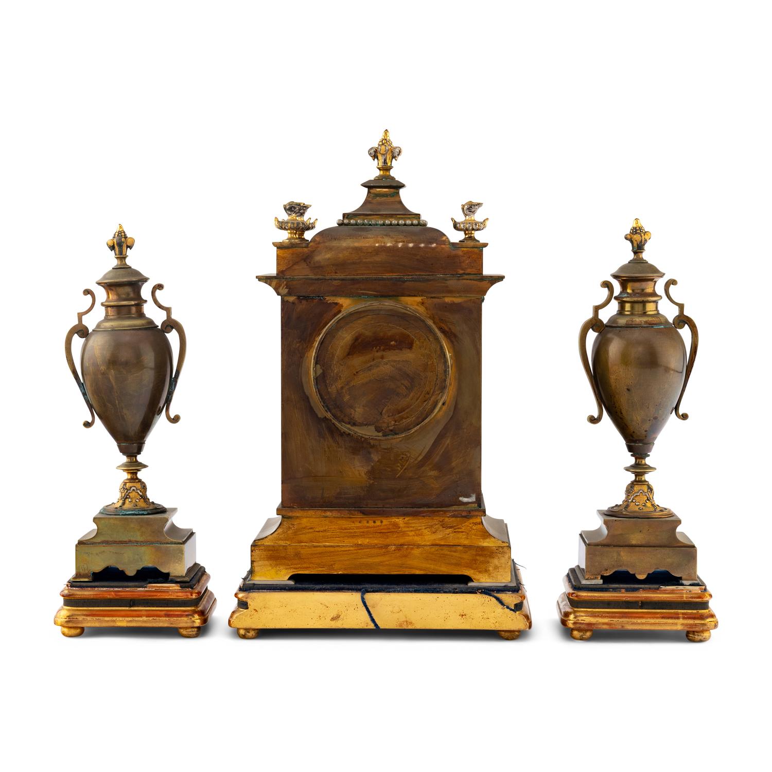 A French Brass and Mixed Metals Clock Garniture