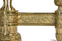 A Pair of Louis XVI Style Gilt Bronze Chenets with Flaming Urn Finials — 20TH CENTURY