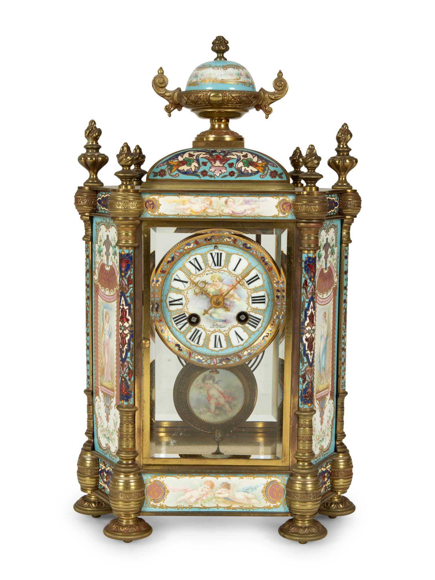 A French Porcelain, Gilt Bronze and Champlevé Clock — CIRCA 1900