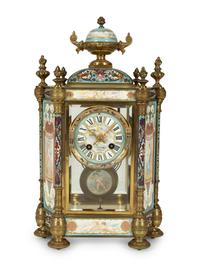 A French Porcelain, Gilt Bronze and Champlevé Clock — CIRCA 1900