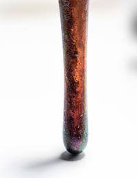 A Roman Aubergine Glass Unguentarium
