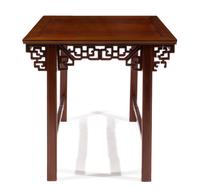 A Carved Hardwood Table — 20TH CENTURY