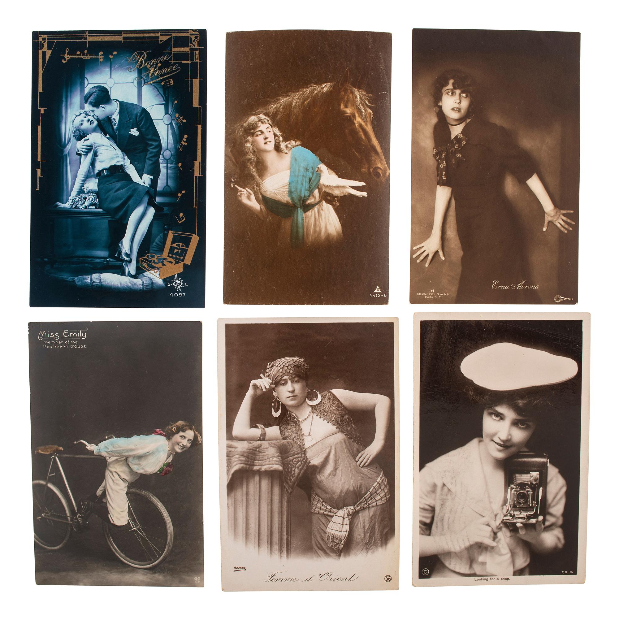 [EARLY PHOTOGRAPHY]. A group of 59 real photo postcards, featuring artfully posed images of women, famous subjects, and genre scenes celebrating romance and the holiday season.