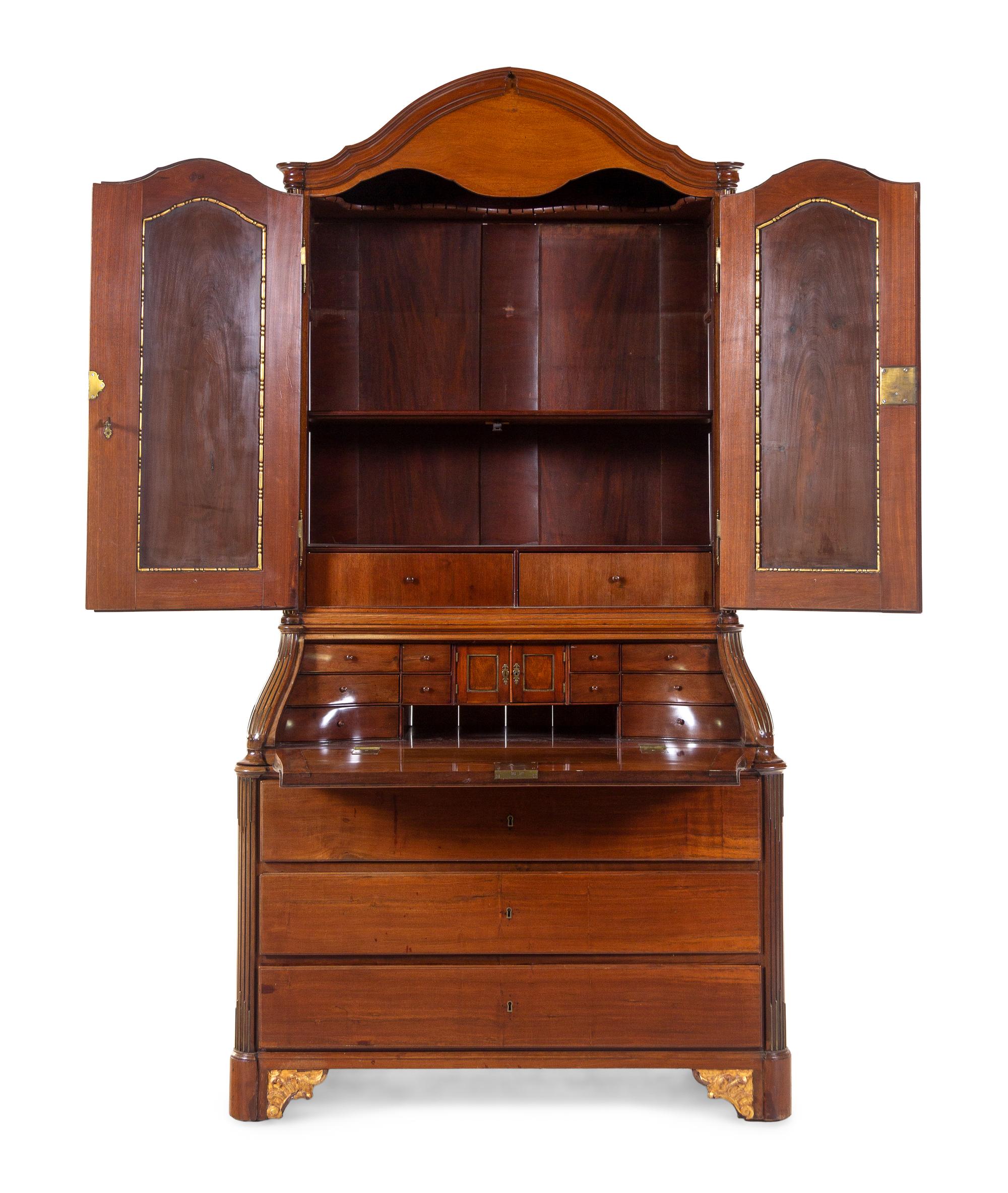 A Baltic Neoclassical Parcel Gilt Walnut Secretary