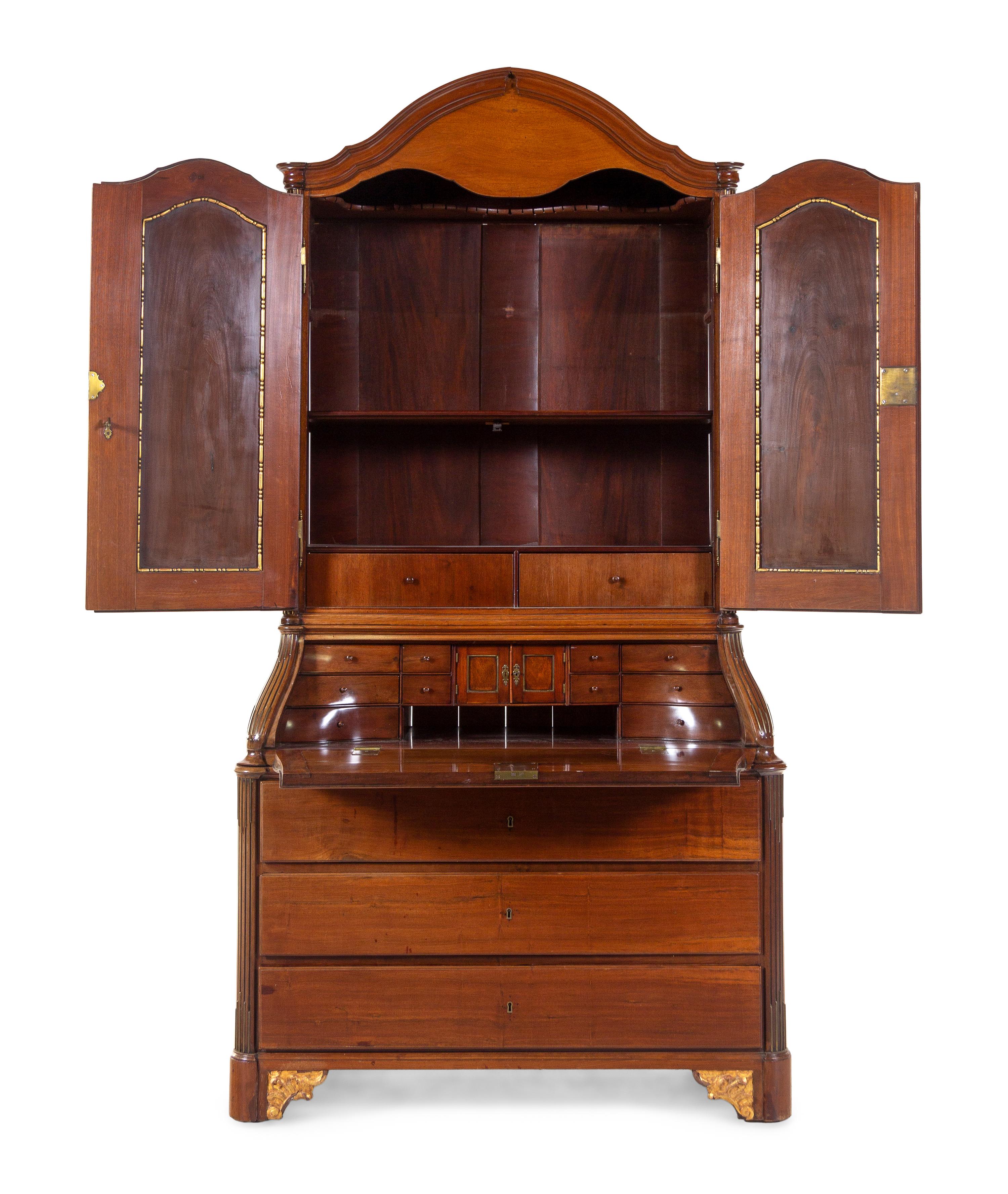 A Baltic Neoclassical Parcel Gilt Walnut Secretary