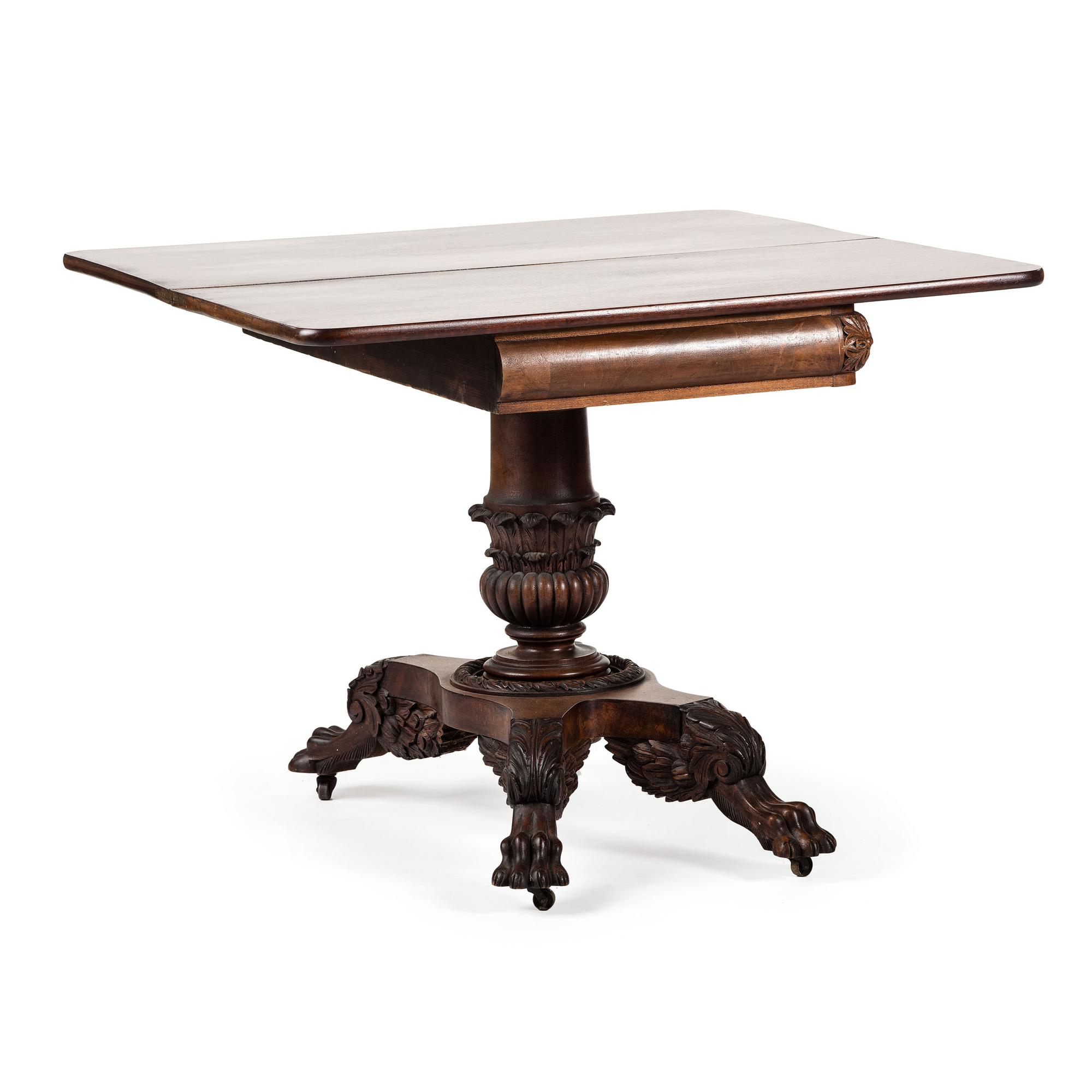 A Classical Carved Mahogany Claw-Foot Game Table