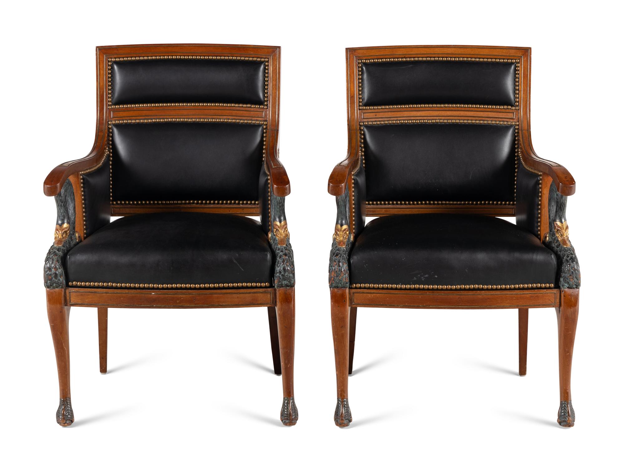 A Pair of Empire Style Painted and Parcel Gilt Mahogany Armchairs