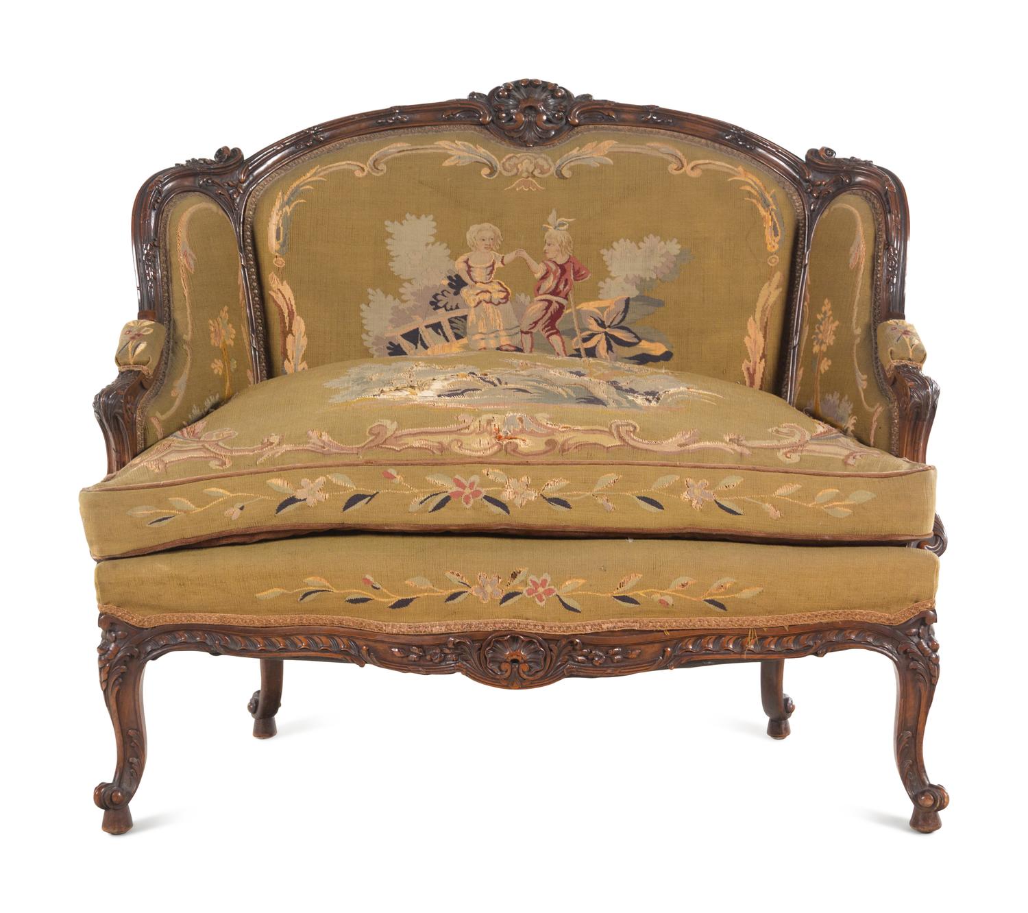 A Louis XV Style Carved Walnut Settee with Tapestry Upholstery