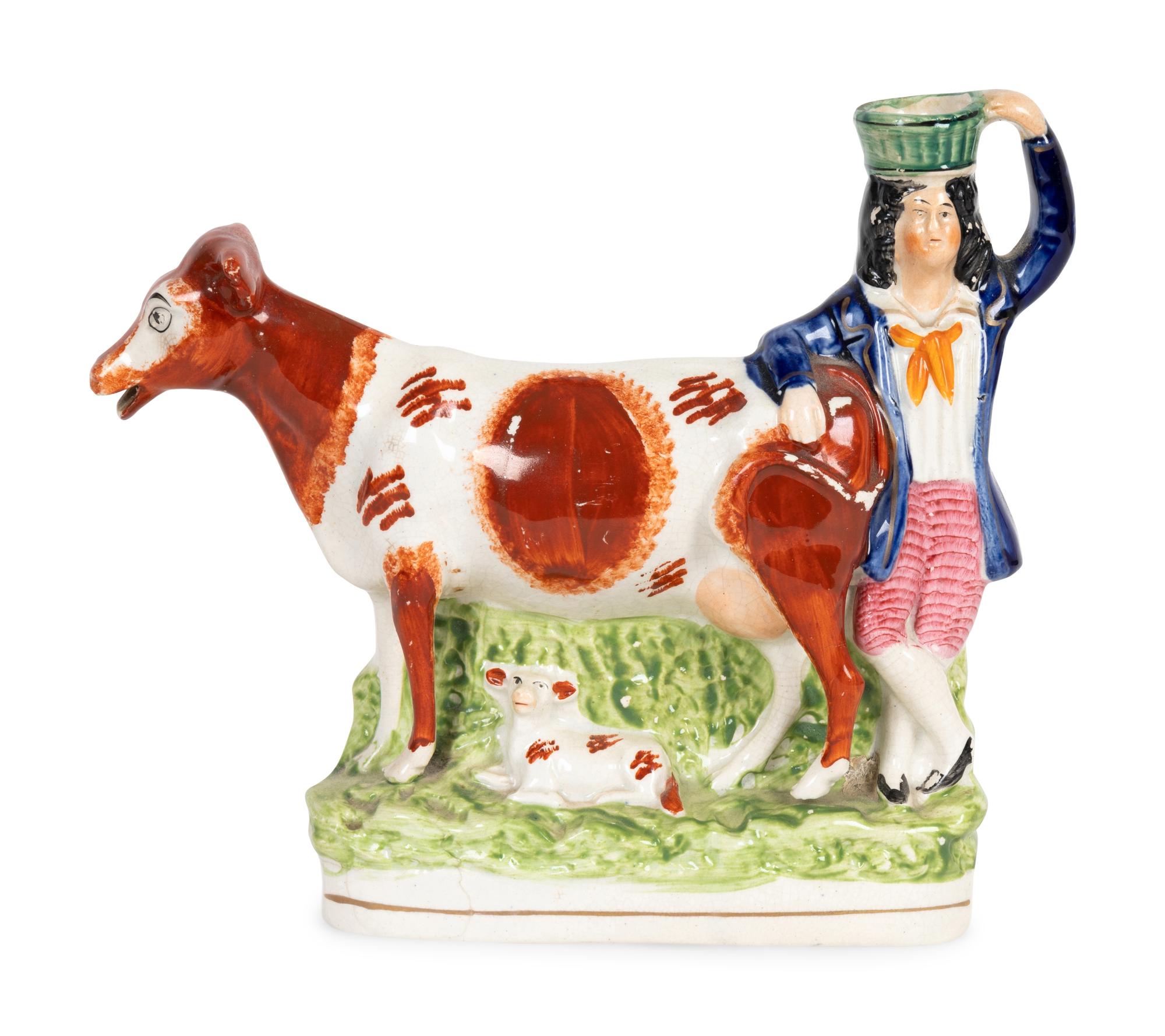A Collection of Twelve Staffordshire Pottery Figures and Figural Wares