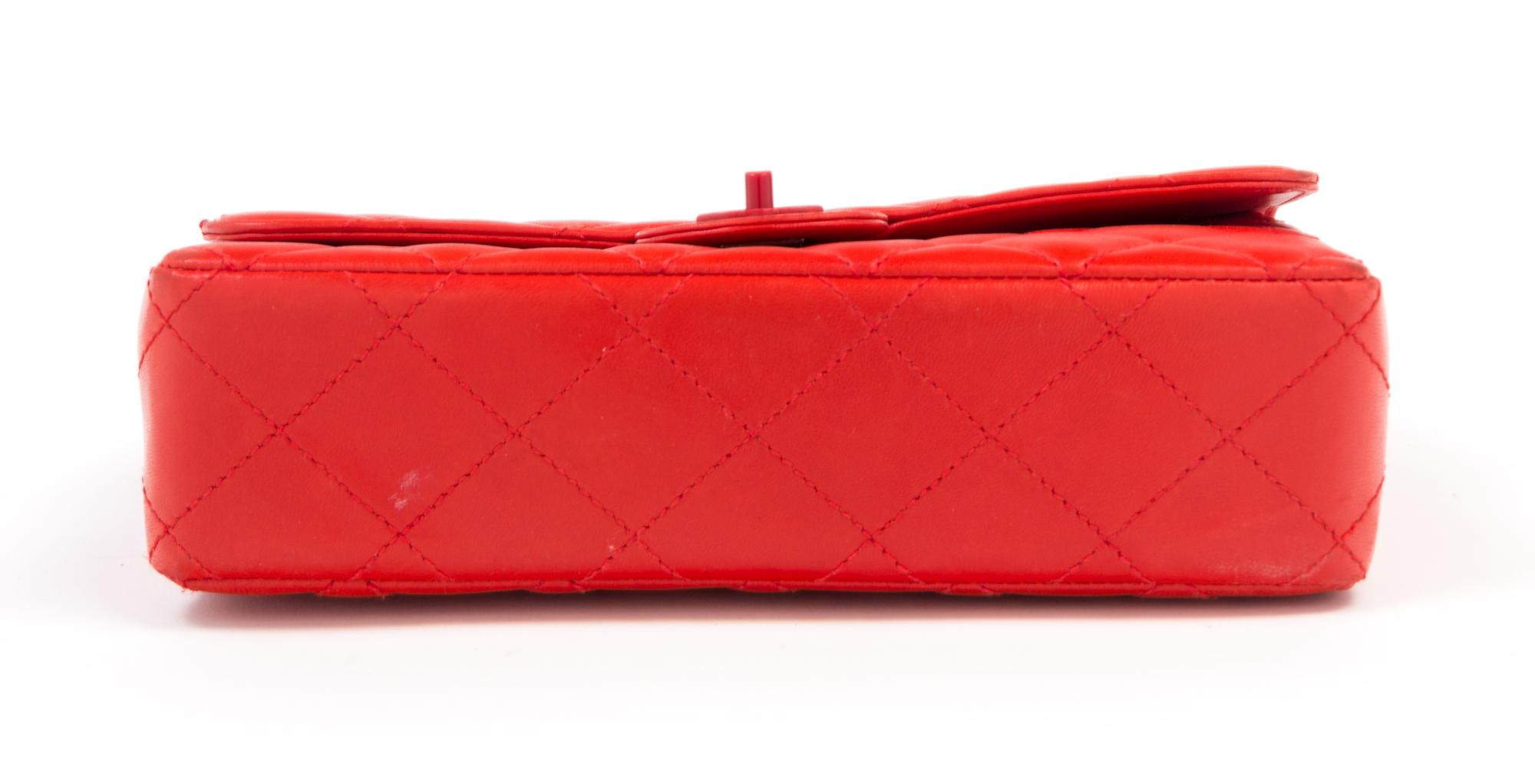 A Chanel Red Lambskin Quilted Flap Bag, 10" x 7" x 2.75"; Strap drop: 19".