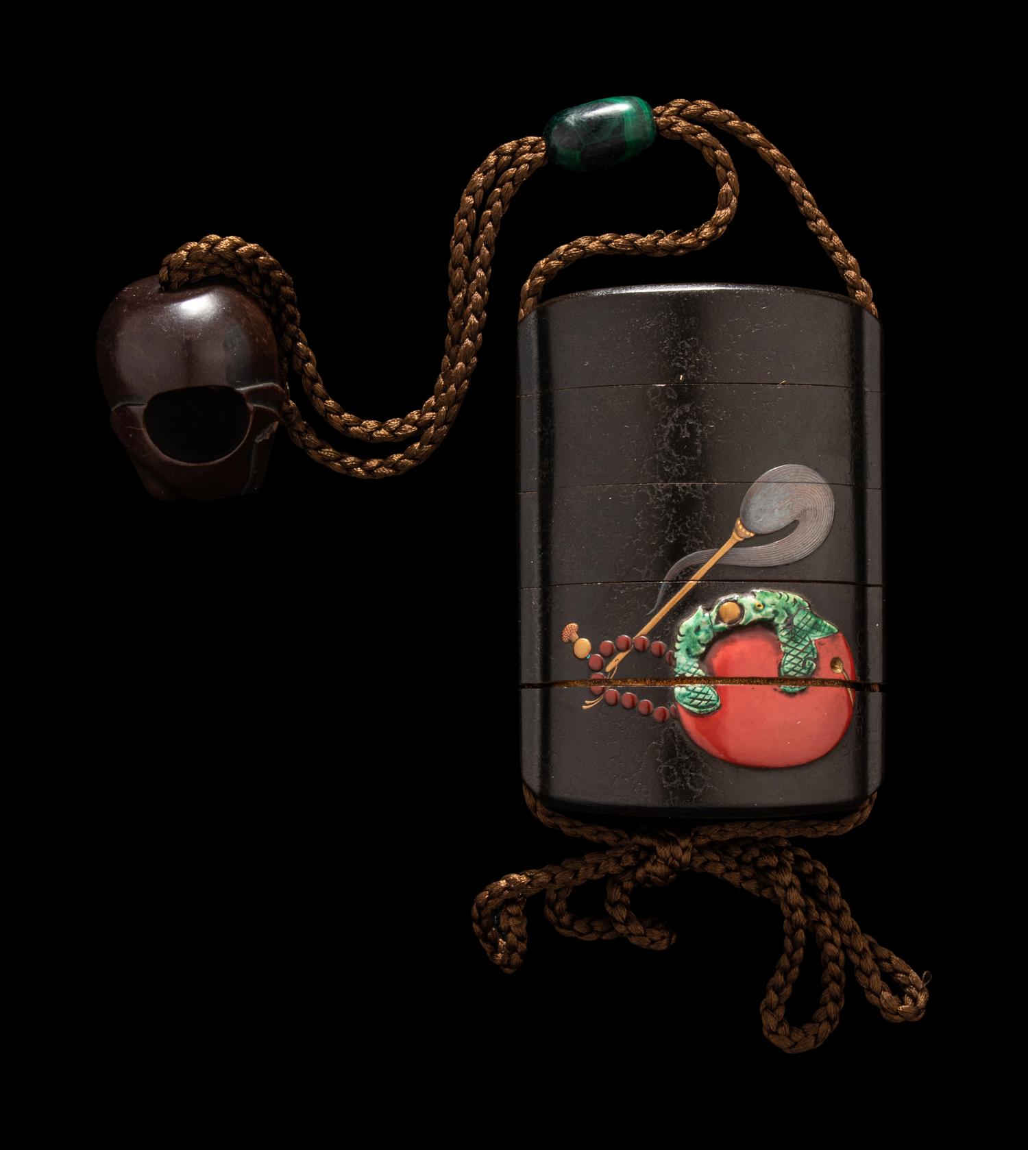 A Japanese Gold and Black Lacquer Four-Case Inro