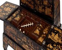 A Chinese Export Black Lacquer and Parcel-Gilt Cabinet and Work Table