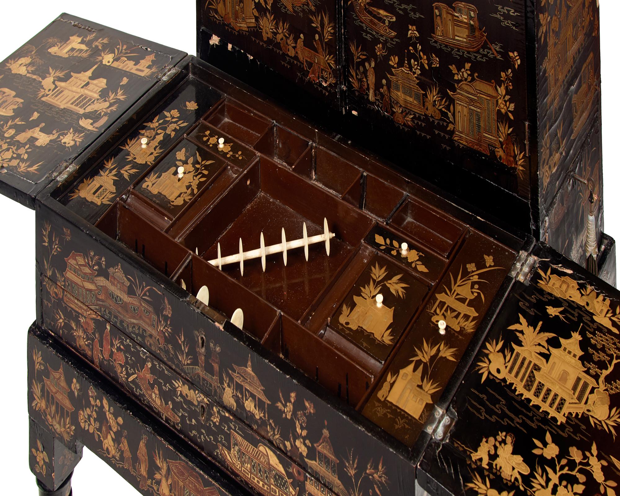A Chinese Export Black Lacquer and Parcel-Gilt Cabinet and Work Table