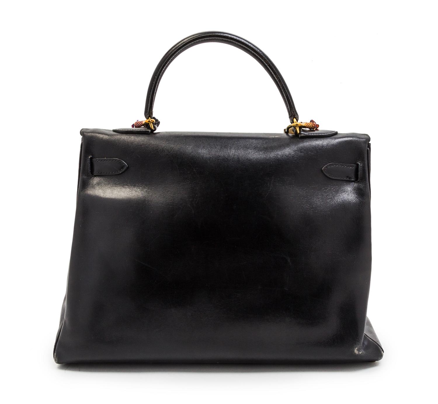 An Hermes 35cm Black Leather Kelly Bag, 14 x 8 x 7 inches.
