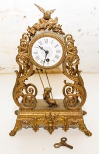 A Louis XV Style Gilt Metal Mantel Clock Height 12 inches.