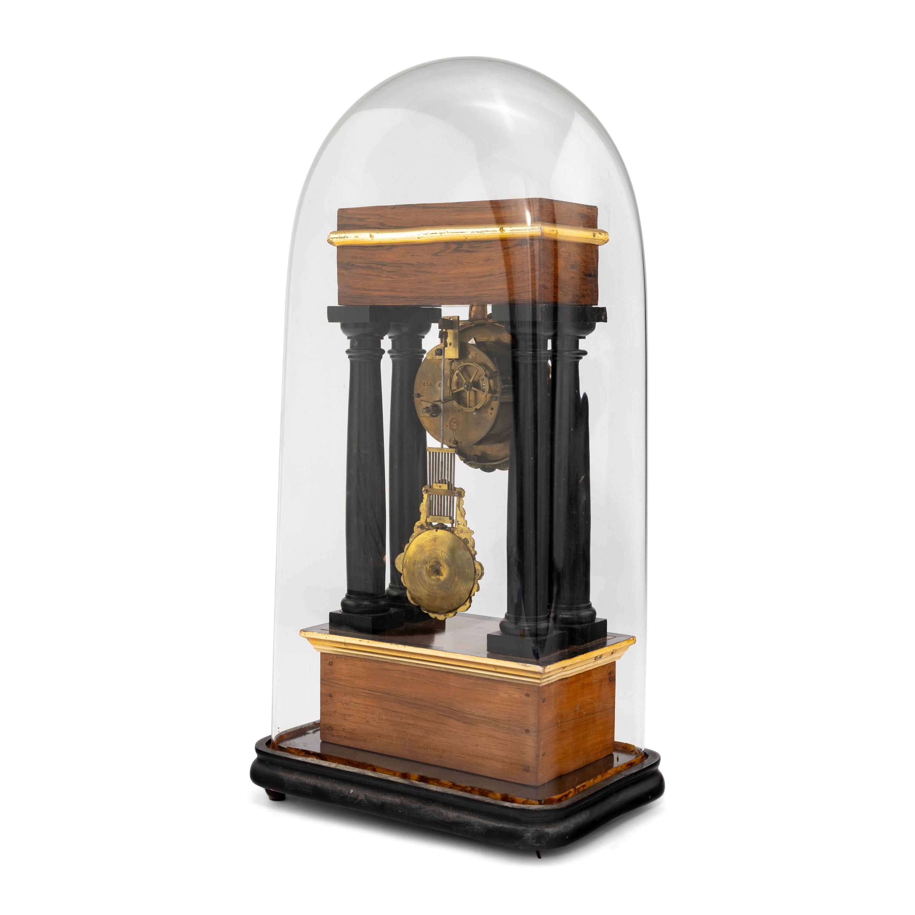 A French Rosewood and Part Ebonized Mantel Clock