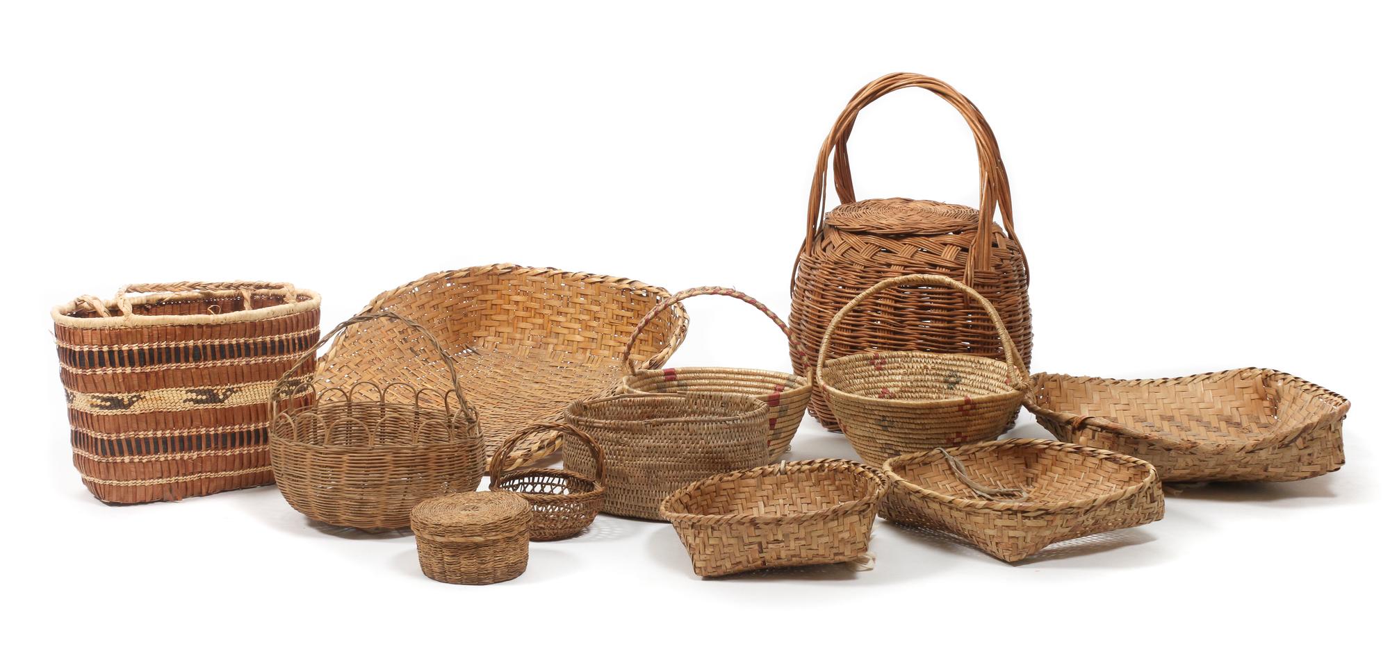 Twelve Native Made Baskets Length of largest 22 x width 18 inches.