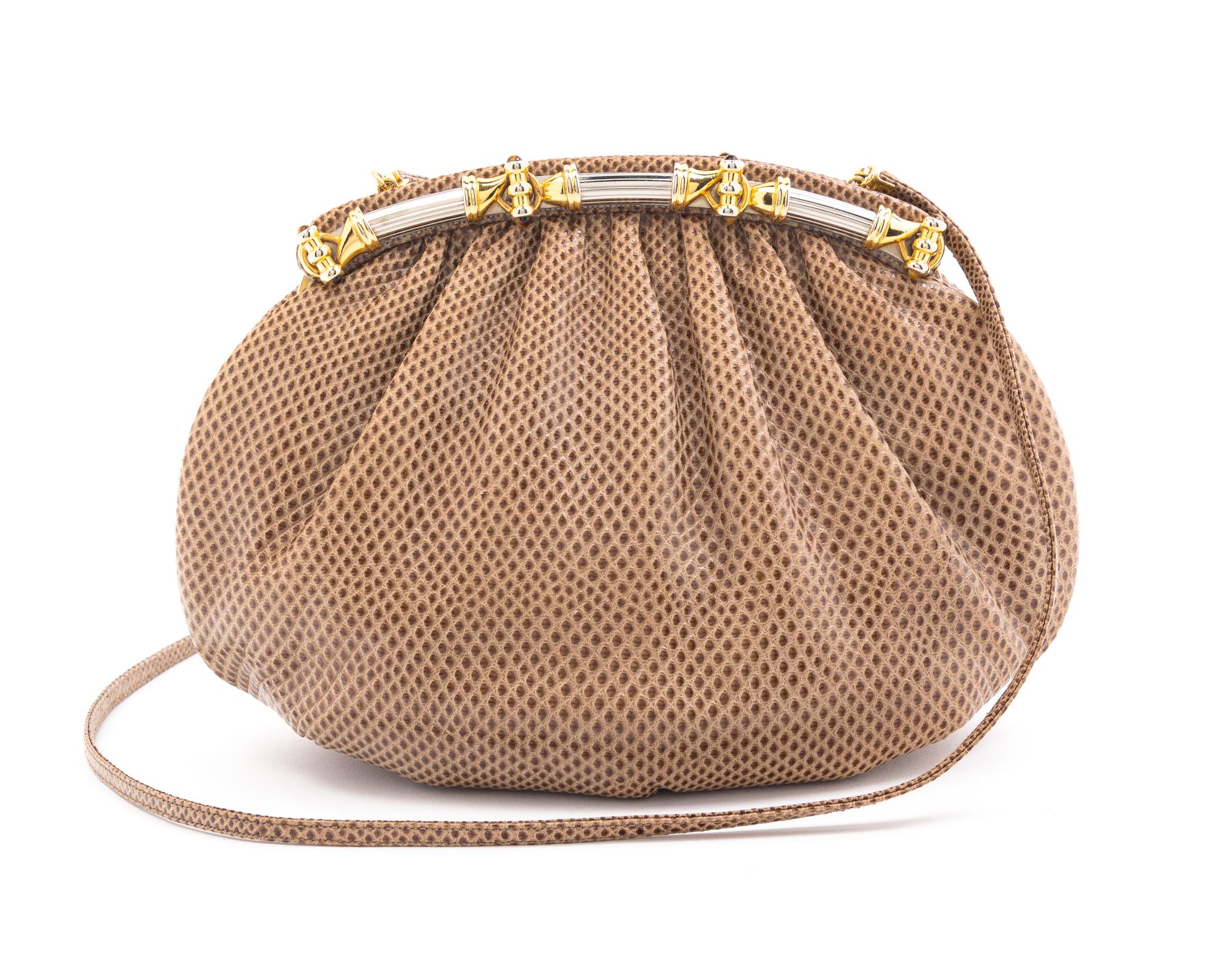 A Judith Leiber Light Brown Skin Clutch, 9" x 6" x 2".