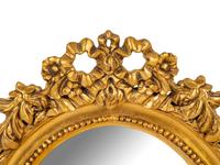 A George III Style Gilt Decorated Oval Mirror