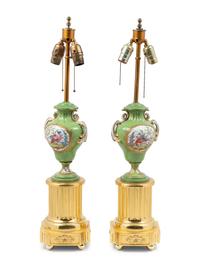 A Pair of Sèvres Style Porcelain and Giltwood Urns Mounted as Lamps