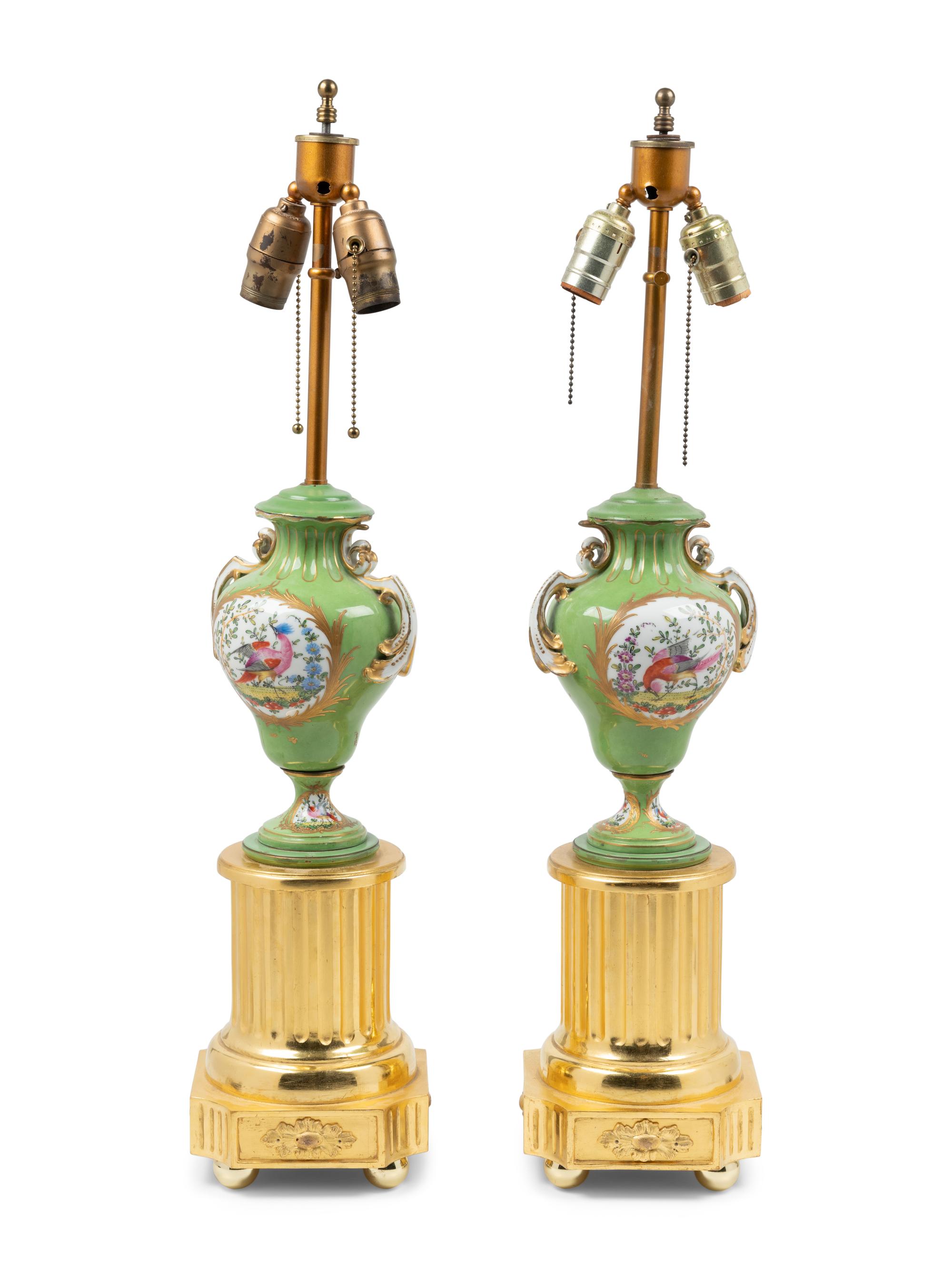 A Pair of Sèvres Style Porcelain and Giltwood Urns Mounted as Lamps