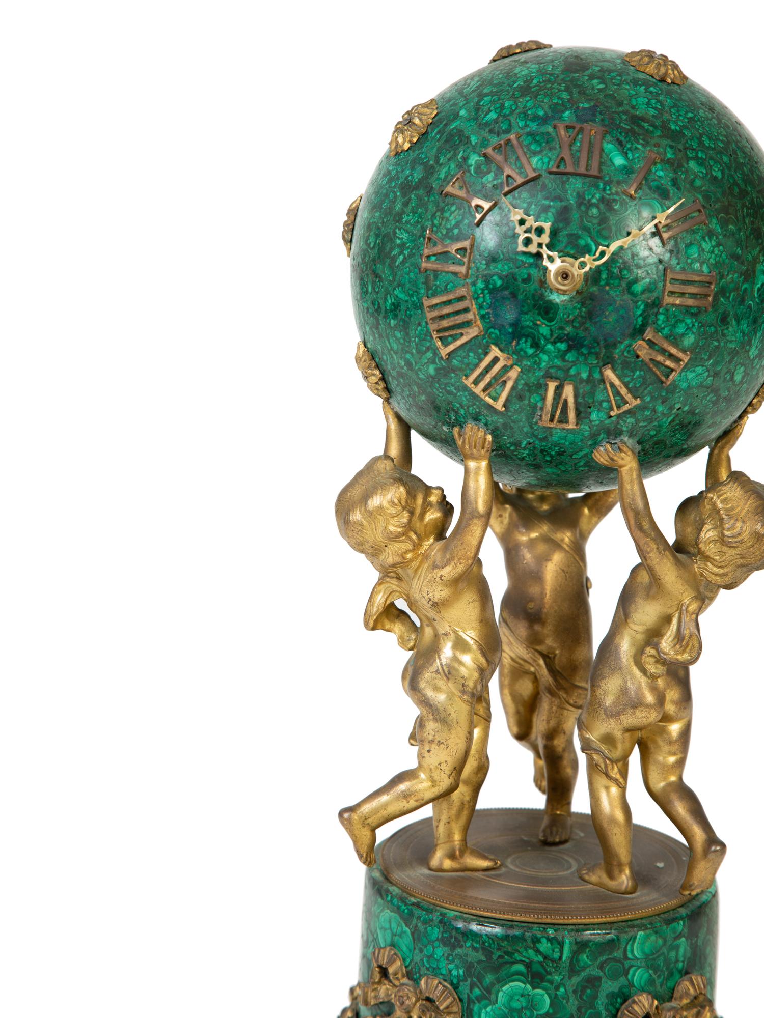 A French Empire Style Gilt Bronze Mounted Malachite Clock — 19TH CENTURY