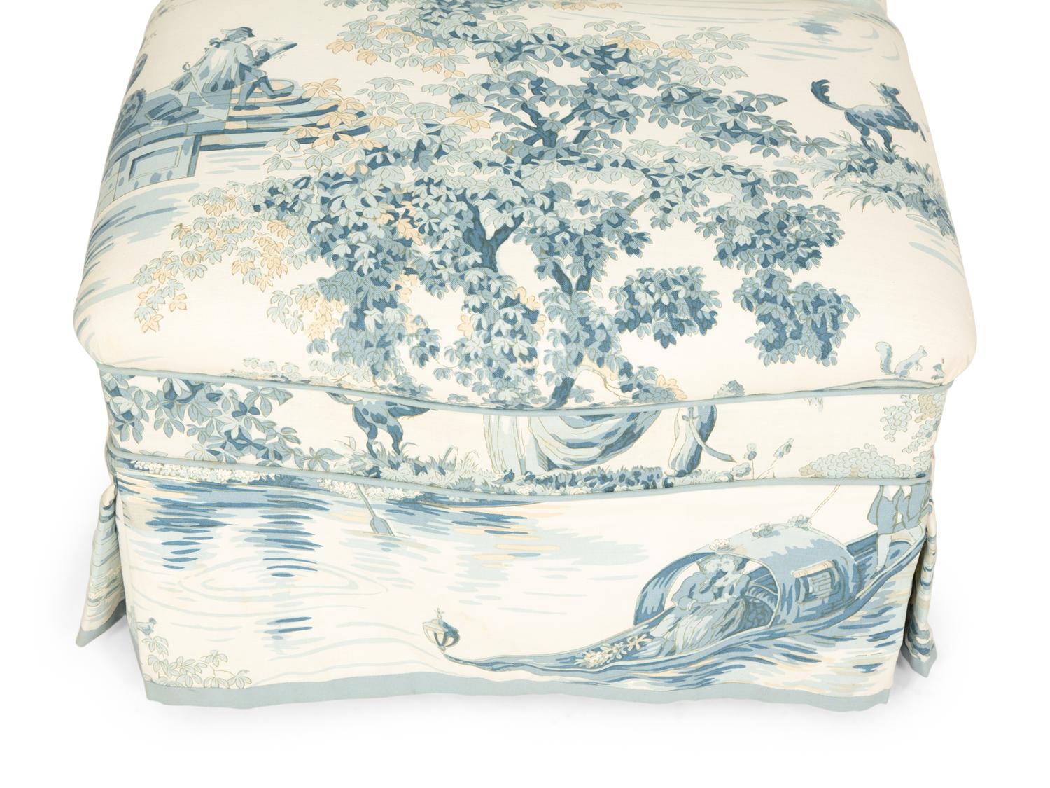 A Blue, White and Cream Upholstered Club Chair and Ottoman