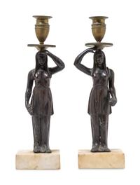 A Pair of Bronze Figural Candlesticks