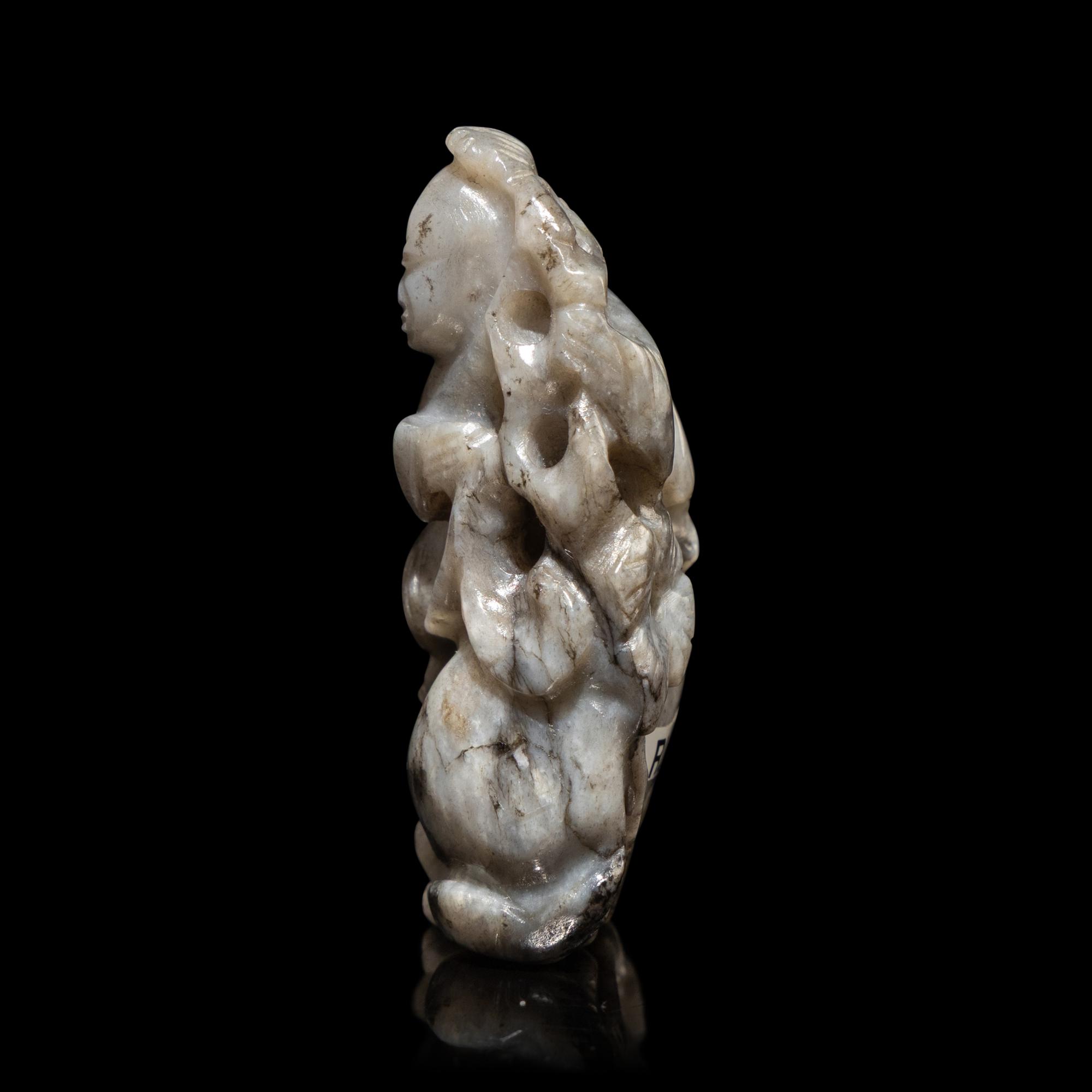 A Chinese Greyish Jade Figure of a Boy, Qing Dynasty — 清 灰玉童子佩