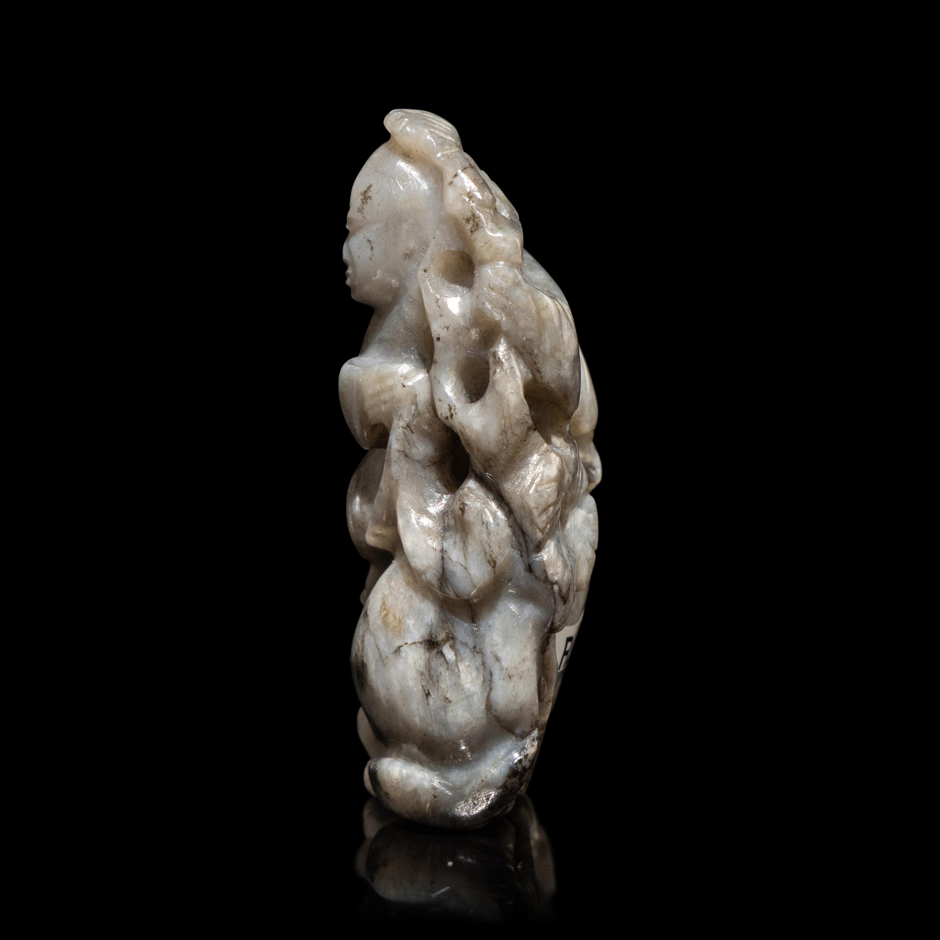 A Chinese Greyish Jade Figure of a Boy, Qing Dynasty — 清 灰玉童子佩