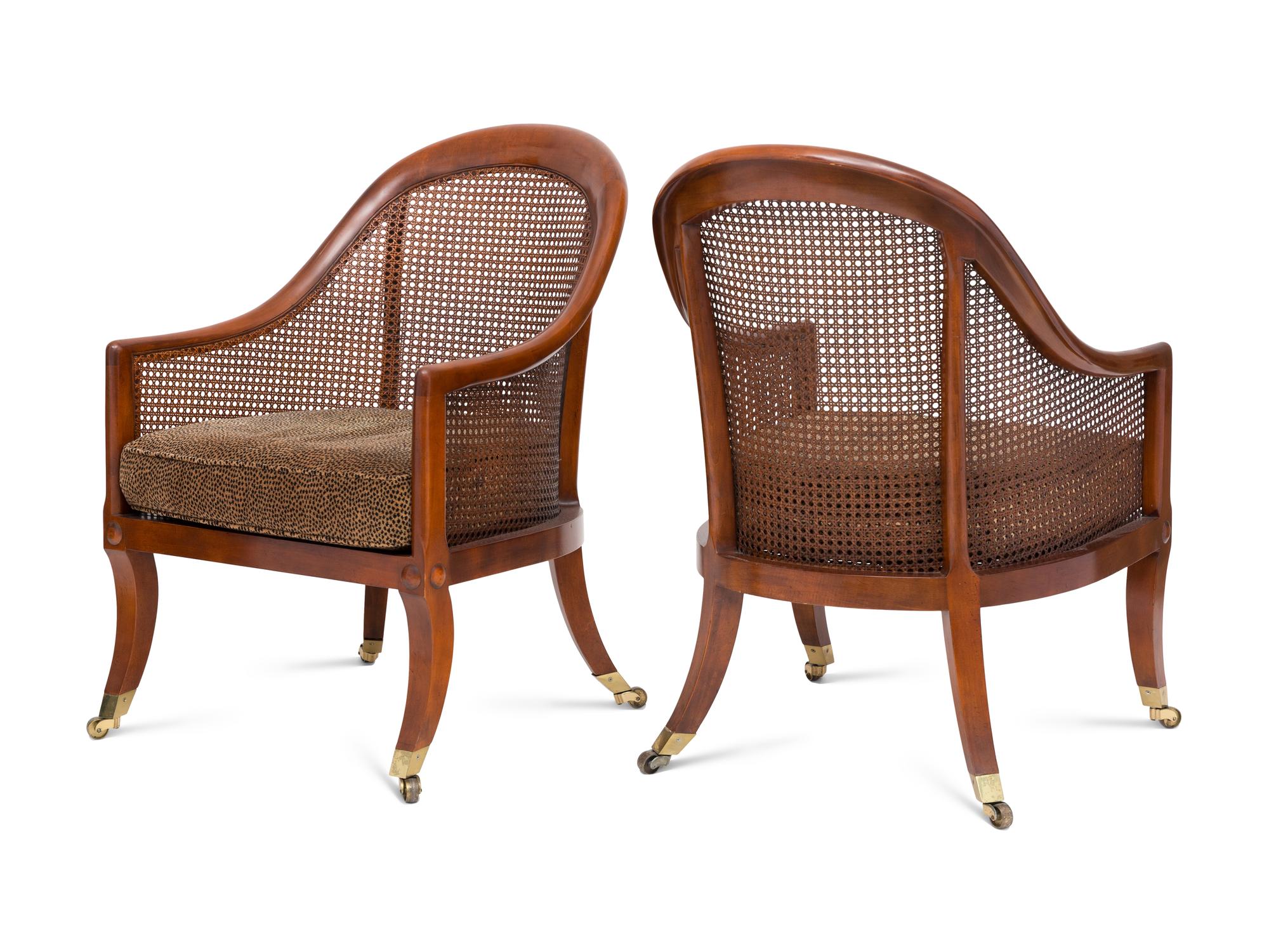 A Pair of Regency Style Walnut and Cane Barrel Chairs