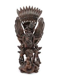 A Thai Carved Wood Figural Group of a Deity and Animals